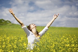 bigstock-Young-woman-standing-in-yellow-19498895-300x200